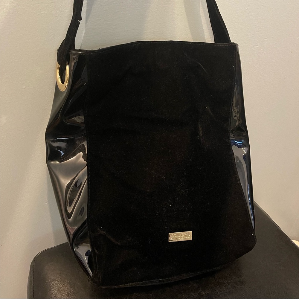 Velvet/patent leather bag.